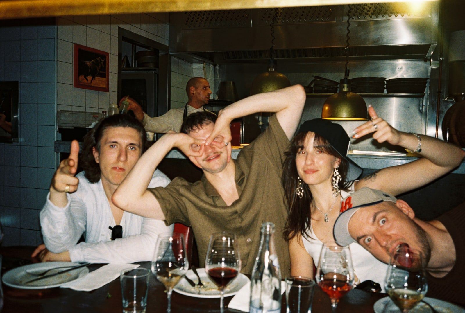 Colleagues posing for the camera at a dinner party