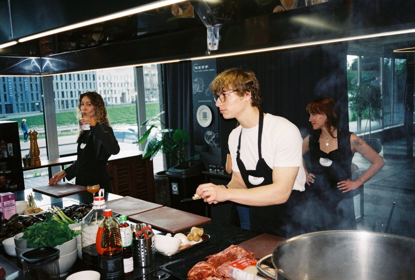 The team preparing food at a kitchen counter