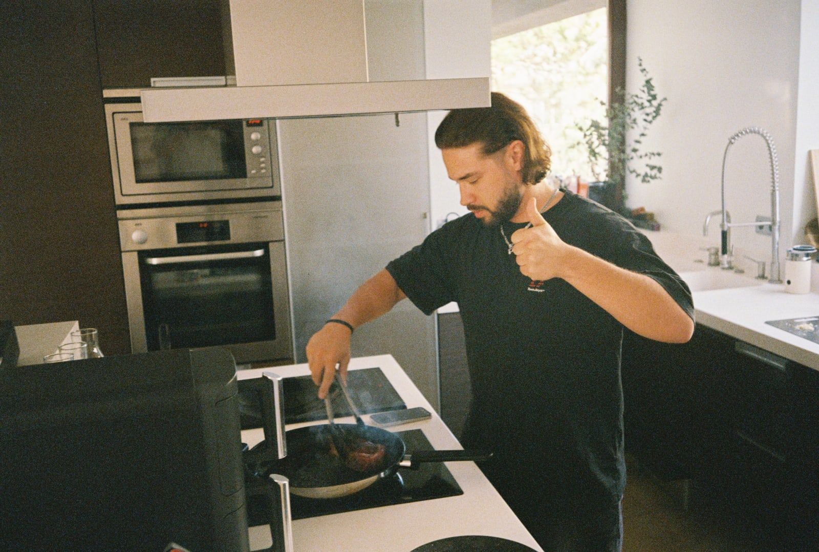 A colleague cooking at the stove